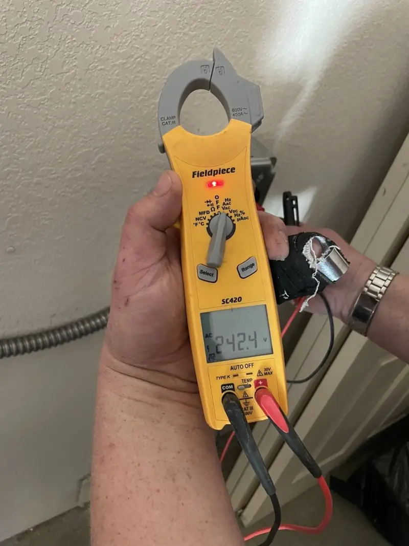Voltage testing with clamp meter during Generator Installation in Corinth